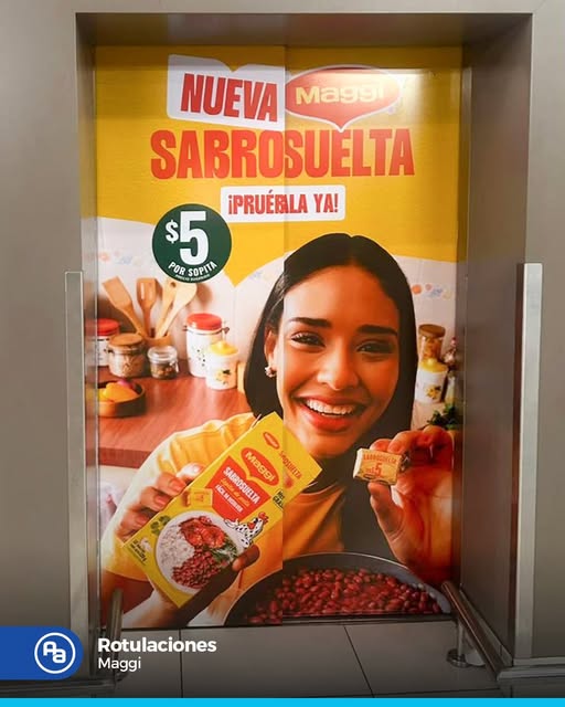 Rotulación de puerta de ascensor con campaña Maggi Sabrosuelta